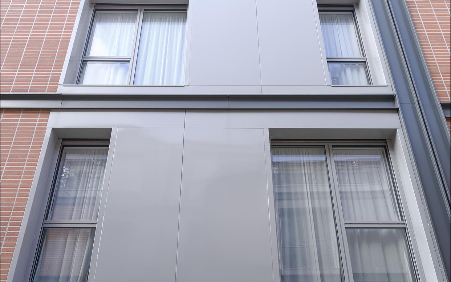Les Orangers de Dantzig, construction neuve à Paris réalisée avec des menuiseries alu K-LINE. 